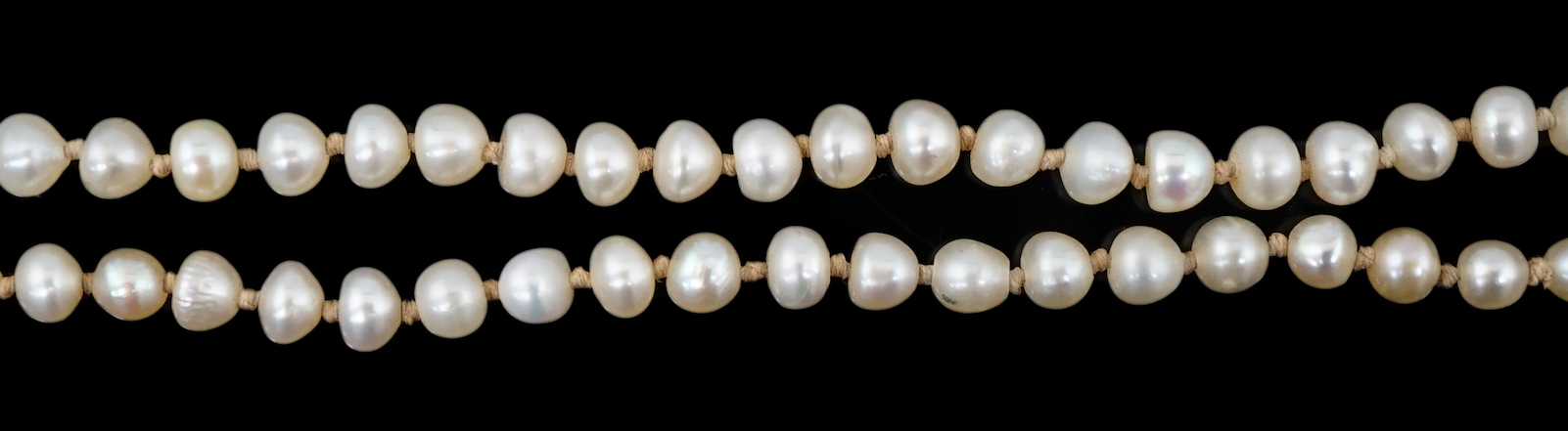 A Victorian single strand graduated natural saltwater pearl necklace, with seed pearl and enamel set gold clasp